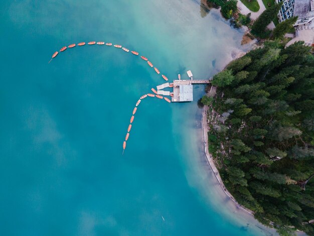 Airplane flying over water against sky