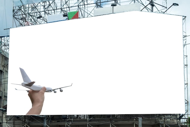 Photo airplane on hand with white large billboard advertise