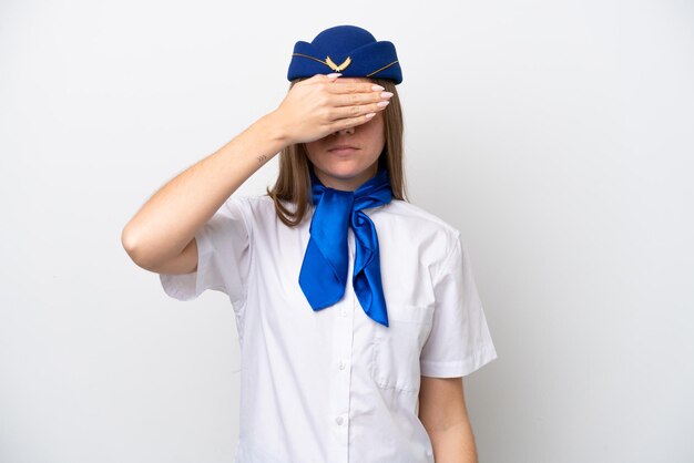 Airplane Lithuanian woman stewardess isolated on white background covering eyes by hands Do not want to see something