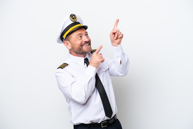 Airplane middle age pilot isolated on white background pointing with the index finger a great idea