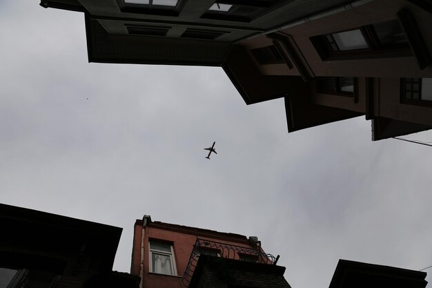 Airplane passing over Fener District in Istanbul Turkey