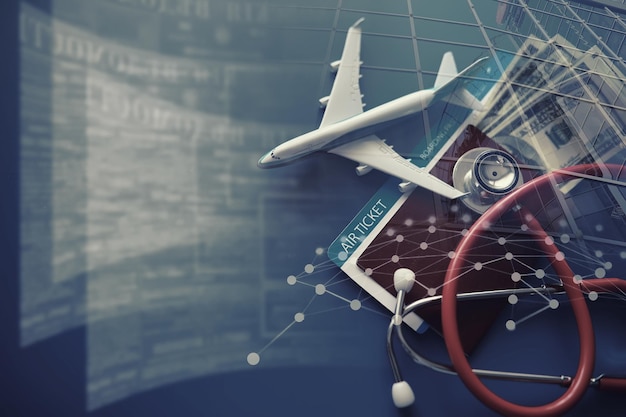飛行機のパスポート搭乗券と聴診器旅客航空保険のコンセプト