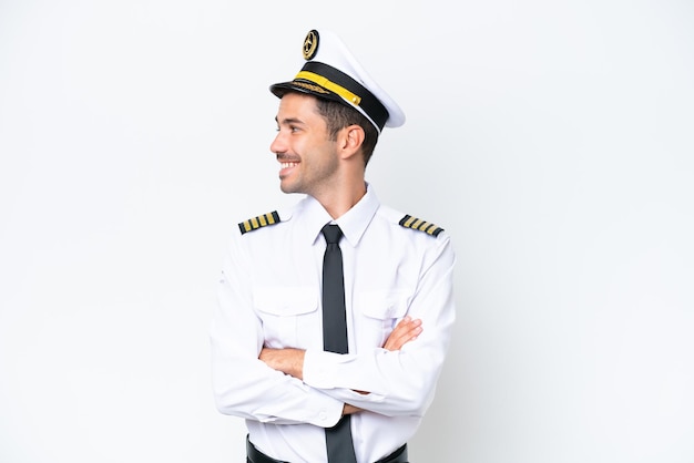 Airplane pilot over isolated white background looking side