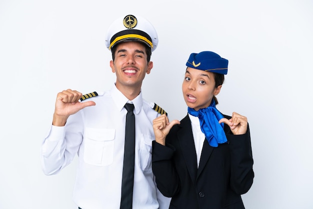 Airplane pilot and mixed race air hostess isolated on white background proud and selfsatisfied in love yourself concept