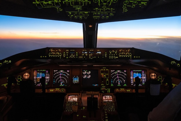 Photo airplane seen through window at sunset