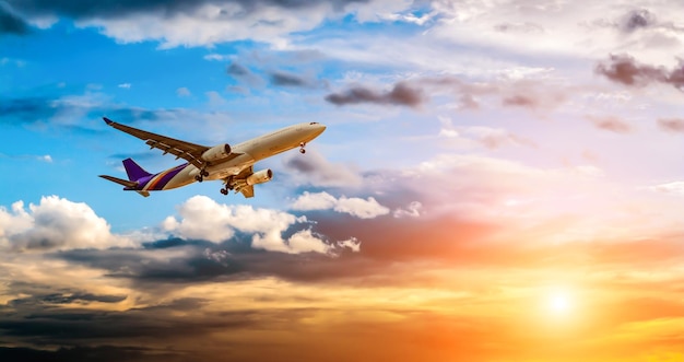 Airplane in the sky at sunrise