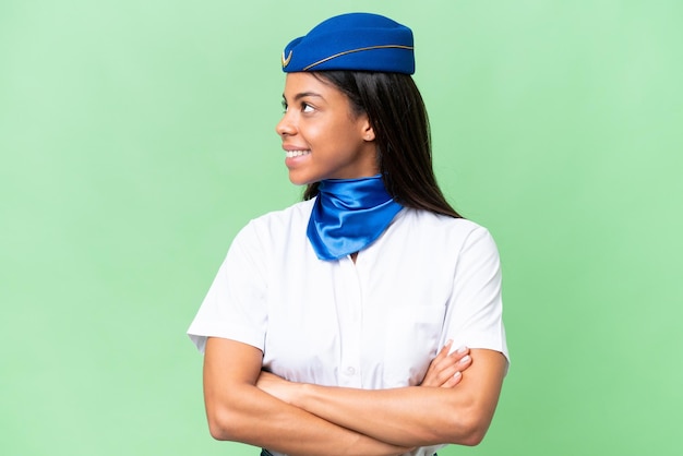 Photo airplane stewardess african american woman over isolated background looking side