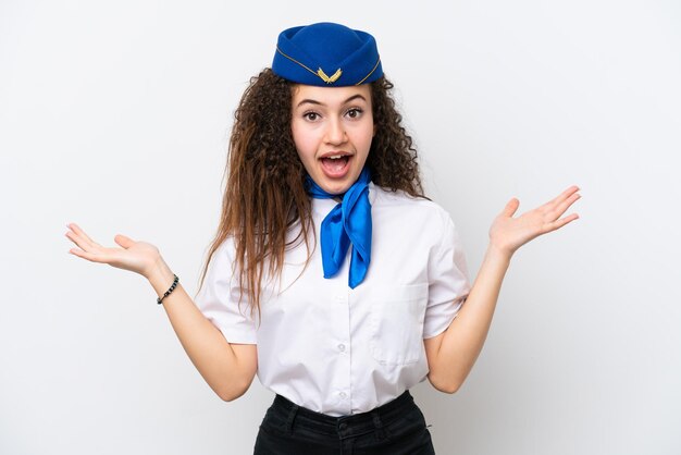 Airplane stewardess Arab woman isolated on white background with shocked facial expression