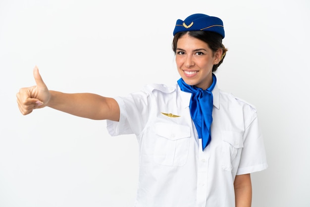 Airplane stewardess caucasian woman isolated on white background giving a thumbs up gesture