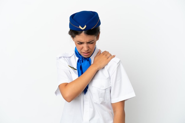 Airplane stewardess caucasian woman isolated on white background suffering from pain in shoulder for having made an effort