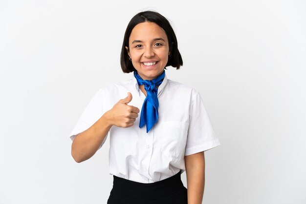 Airplane stewardess over isolated background giving a thumbs up gesture