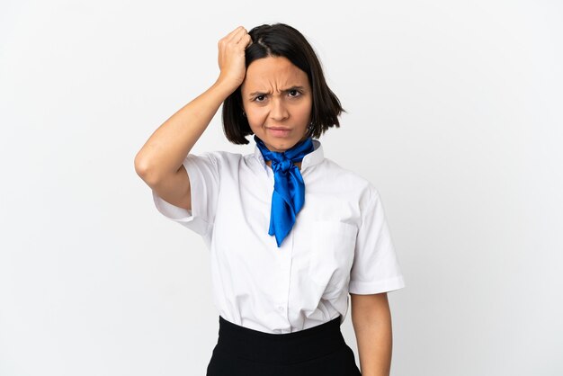 Airplane stewardess over isolated background with an expression of frustration and not understanding