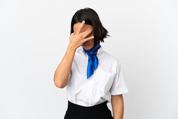 Airplane stewardess over isolated background with headache