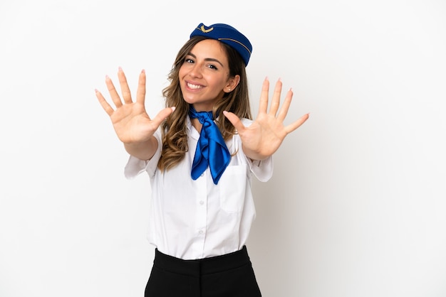 Airplane stewardess over isolated white background counting ten with fingers