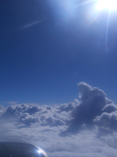 Airplane wing against sky