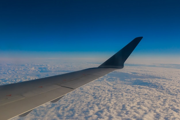 Airplane wing sky clouds