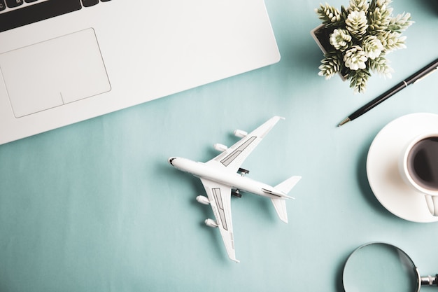 Airplane with keyboard and coffee on desk