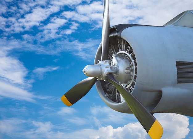 Airscrew on blue sky. Old airplane