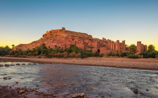 ait benhaddou with asif ounila river in morocco at sunset