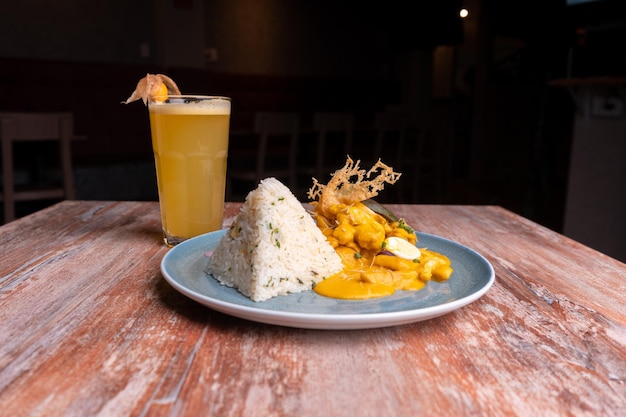 Aji de Gallina on the table of a restaurant, typical food of Peru.