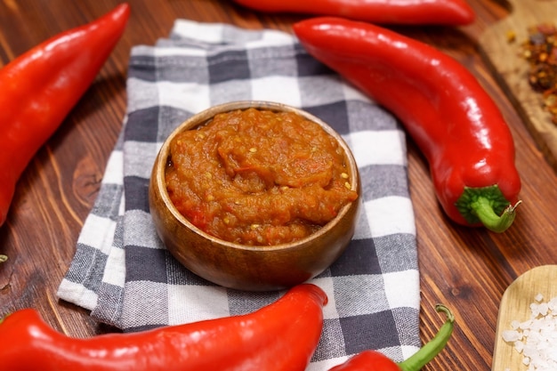 Ajvar delicious dish of red peppers and eggplant Waiting for tasting Wooden background