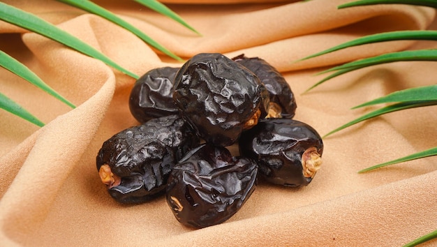 Ajwa al madina natural dates from Saudi Dates fruits on napkin