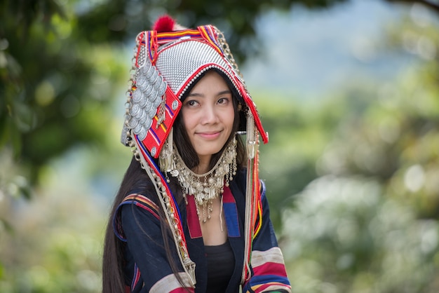 Akha hill picking arabica coffee berries at plantation, Chiang Rai Thailand