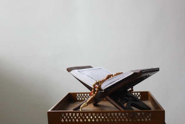 Al quran on table isolated on white background Islamic concept