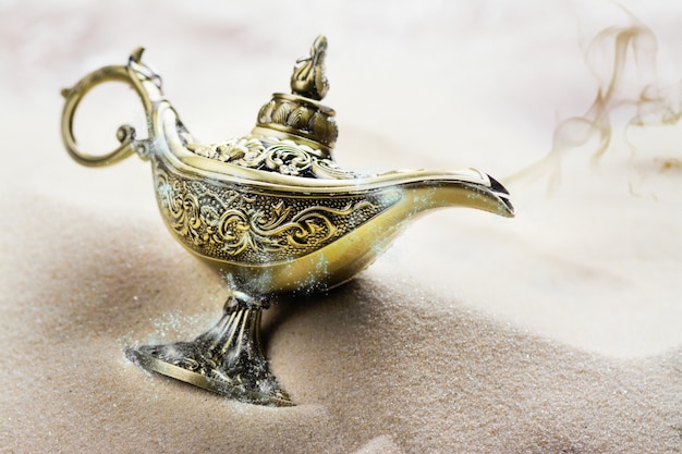 Aladdin magic lamp on the sand