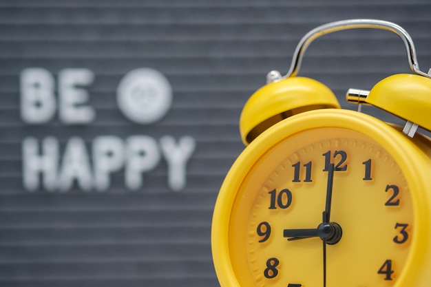 Photo alarm clock on the background of a gray felt board