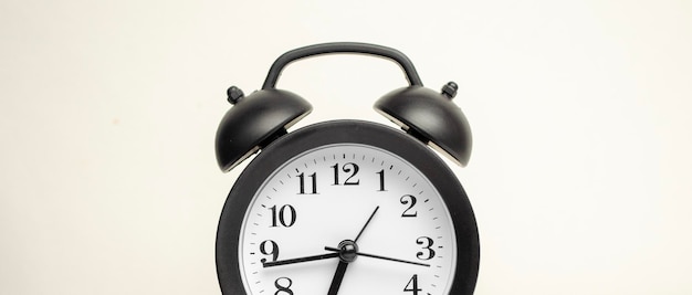 Alarm clock black style vintage place on a white background