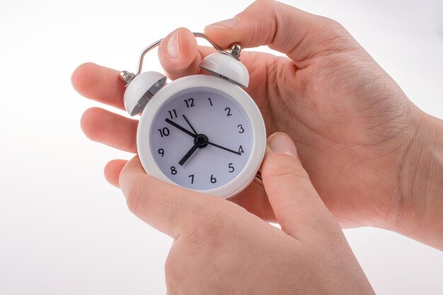 Alarm clock in hand