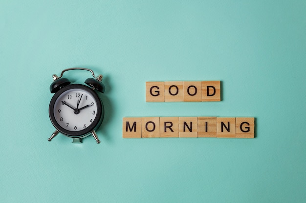 Alarm clock and Inscription GOOD MORNING letters