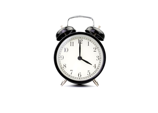 Alarm clock isolated on white shows four o'clock