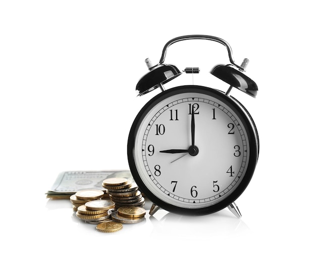 Alarm clock and money on white background