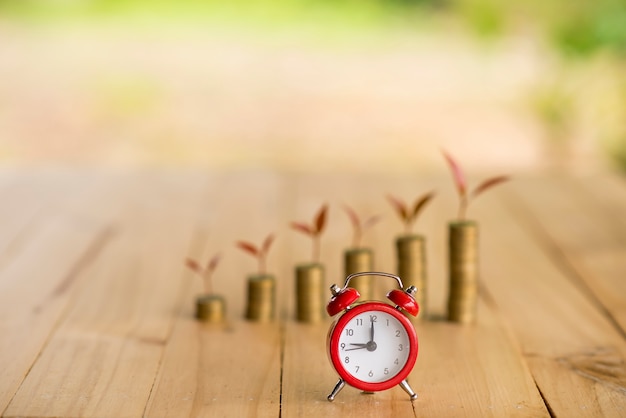 Photo alarm clock and piggy bank concept for saving time