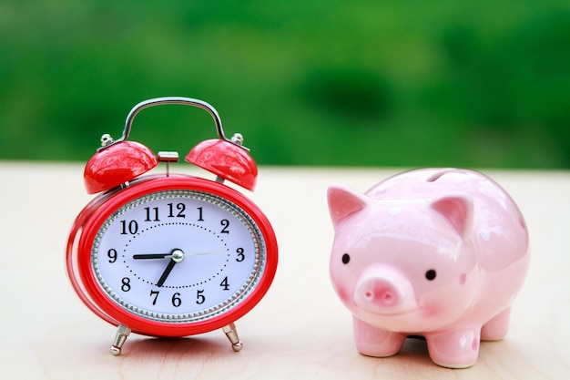 Alarm clock and piggy bank