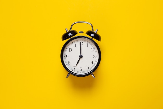 Alarm Clock Shows Hour On A Yellow Background