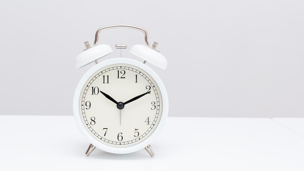 Alarm clock on white table