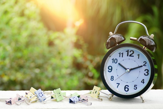 An Alarm clock with a beautiful morning sunshine background Copy space for your text