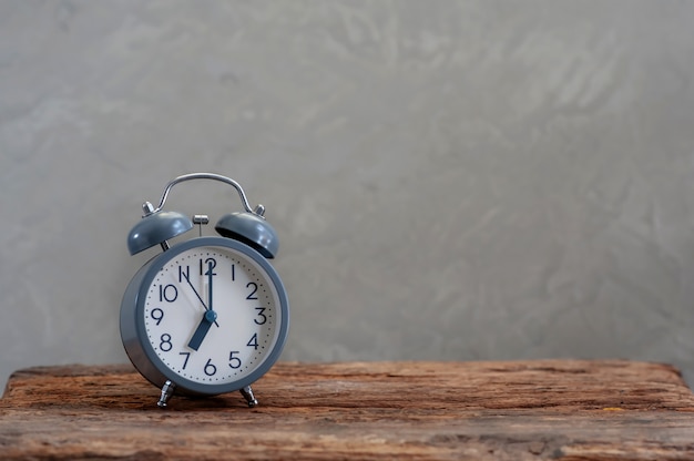 Photo alarm clock on wooden background