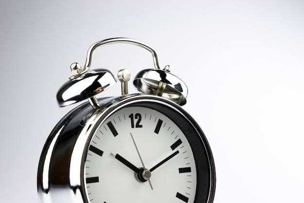 Alarm metal clock on white background