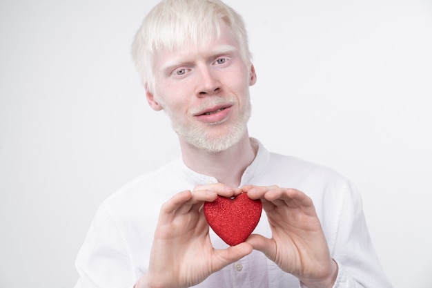 albino man in  studio dressed t-shirt isolated on a white