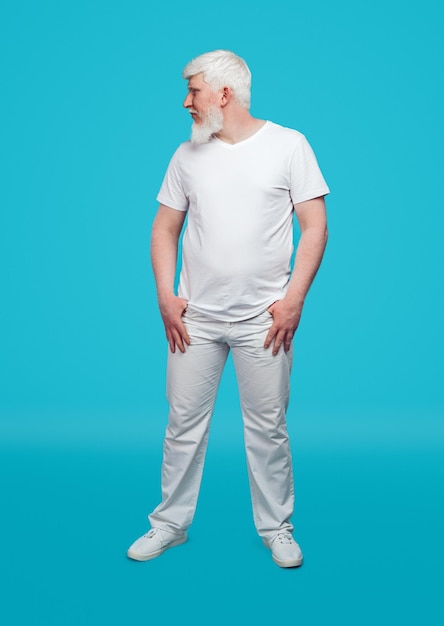 Albino man in white clothes on blue background