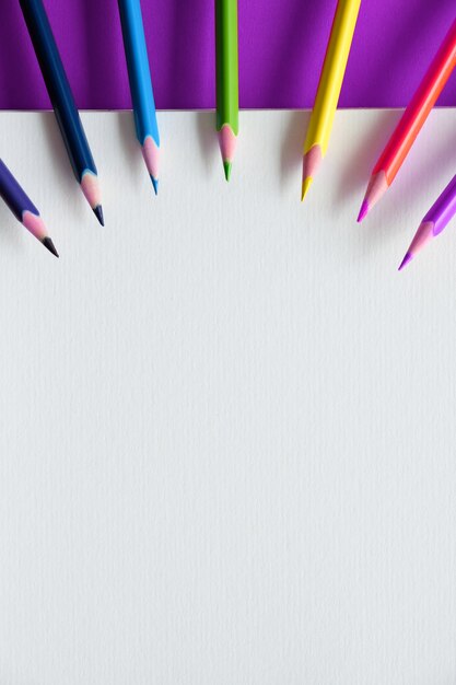 Album and color pencils on the table. Creativity concept.