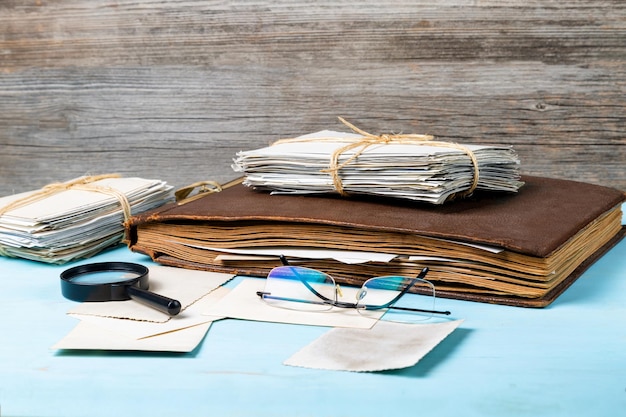 Albums with old family photos on a wooden table