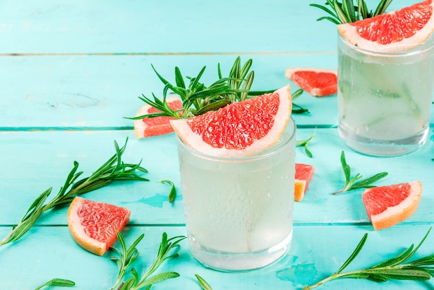 Alcohol drink, Rosemary, Grapefruit & Gin Cocktail, On light blue wooden table , 