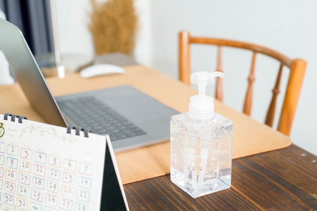 Alcohol gel on working table, healthy concept