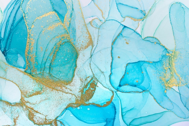 Alcohol ink blue abstract background. Ocean style watercolor texture. Blue and gold paint stains