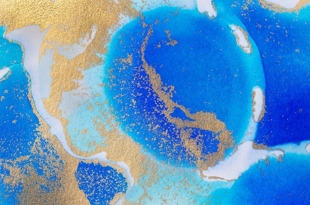 Alcoholbased ink texture in blue tones with gold